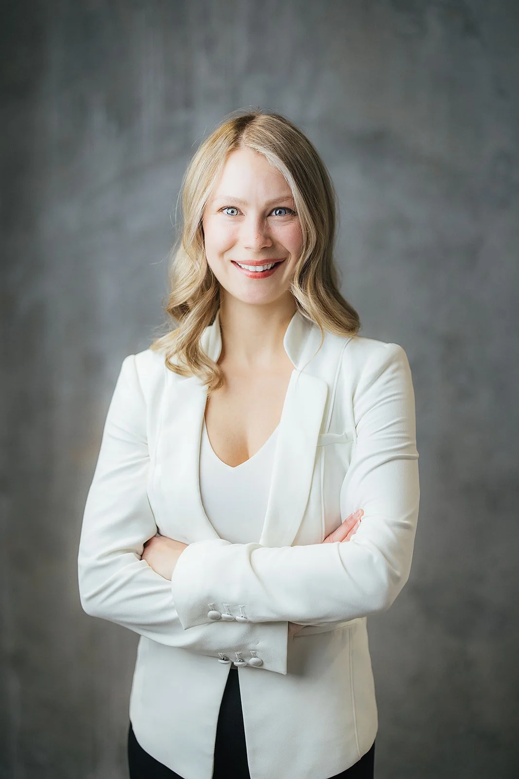 Woman Arms Crossed White Blazer Headshot