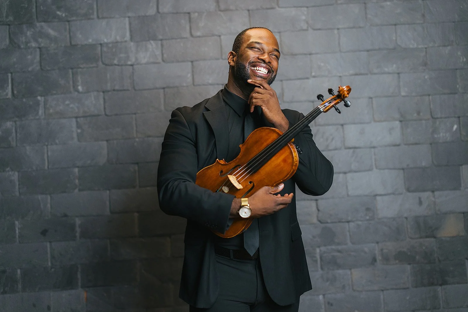 Man Smiling Posing with VIolin Chamber Orchestra of the Triangle