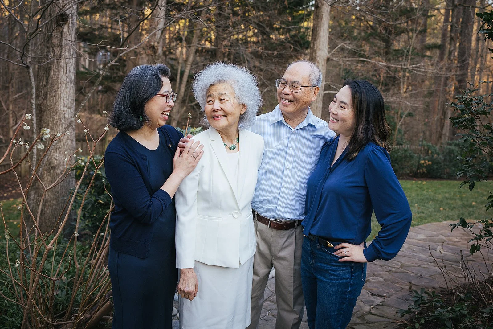 Adult daughters smiling and laughing with parents