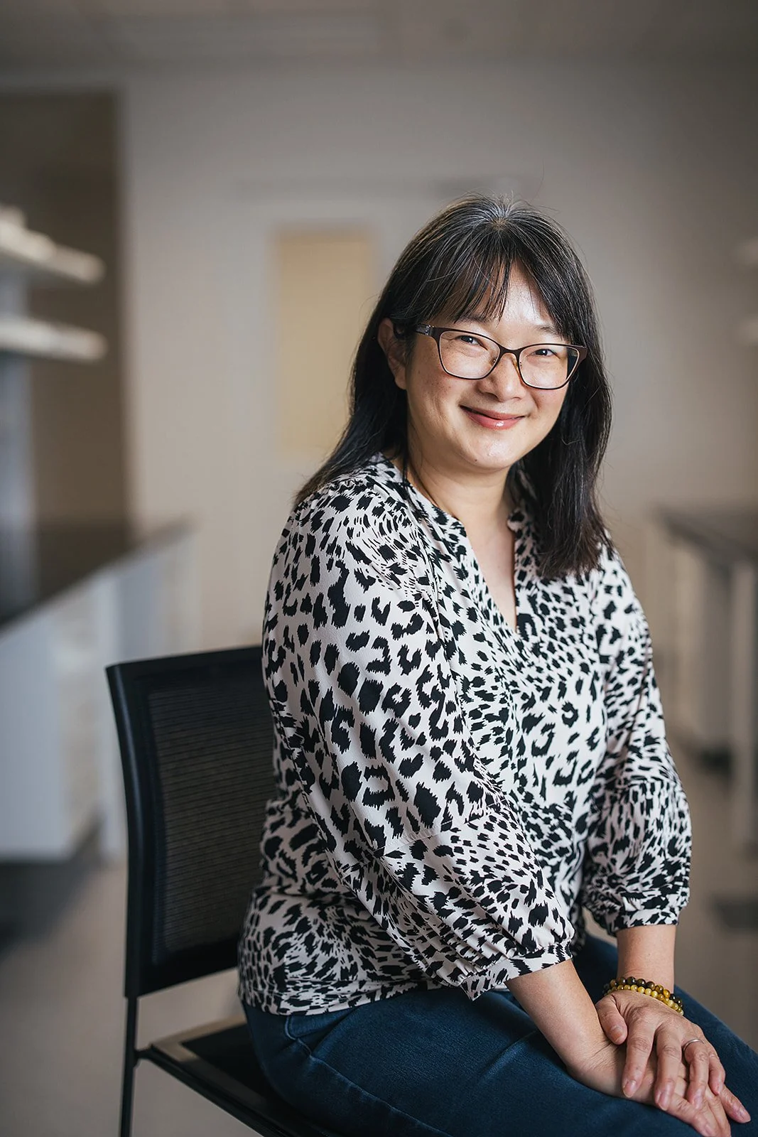 WomanSmilingInBlackAndWhiteShirt