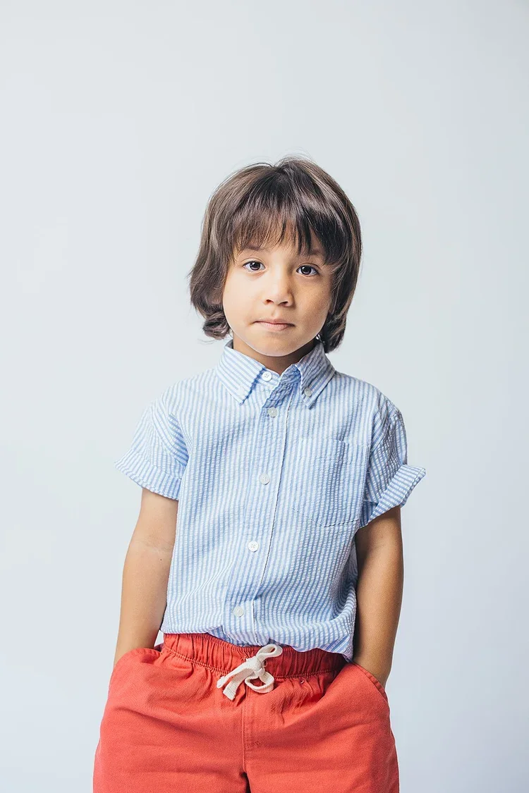 YoungBoyInBlueStripedShirtAndRedShorts.webp