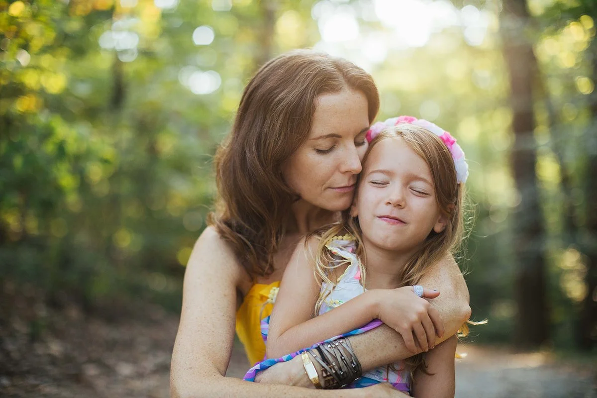 Mother and Daughter Hugging Outside Chapel Hill NC