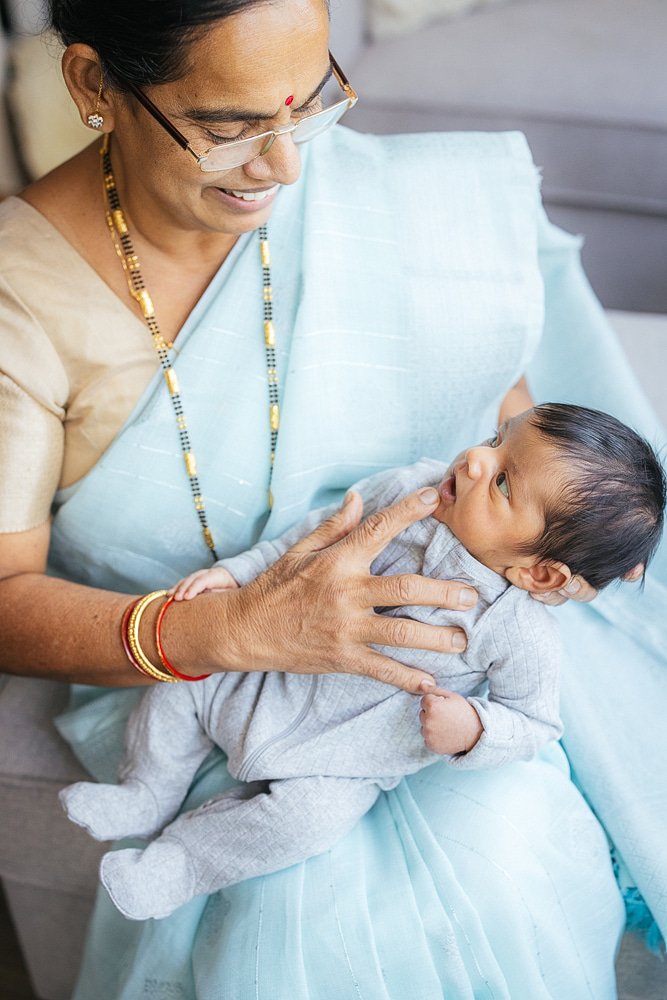 Grandmother holding newborn baby