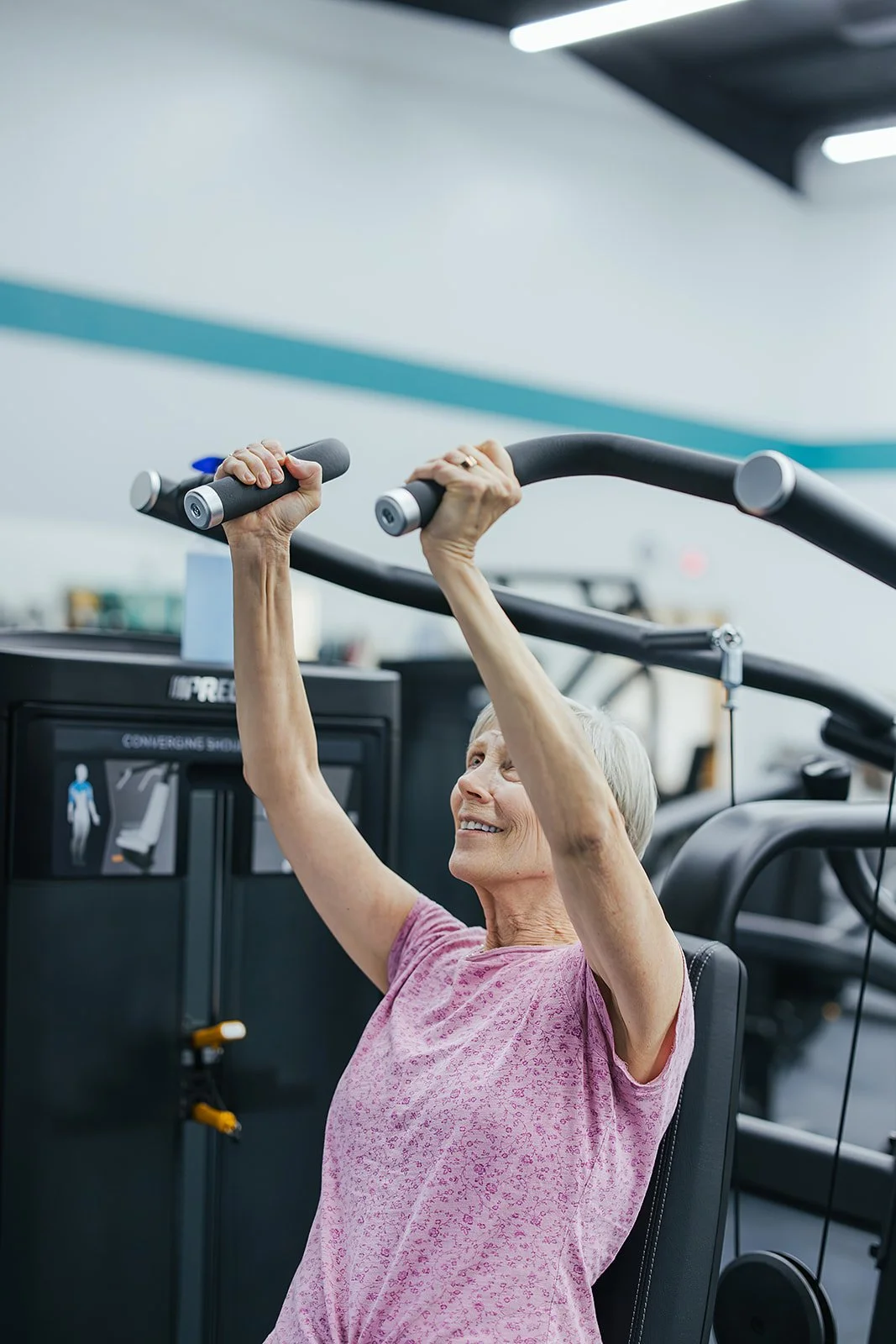 Older woman working out during a sports club photoshoot