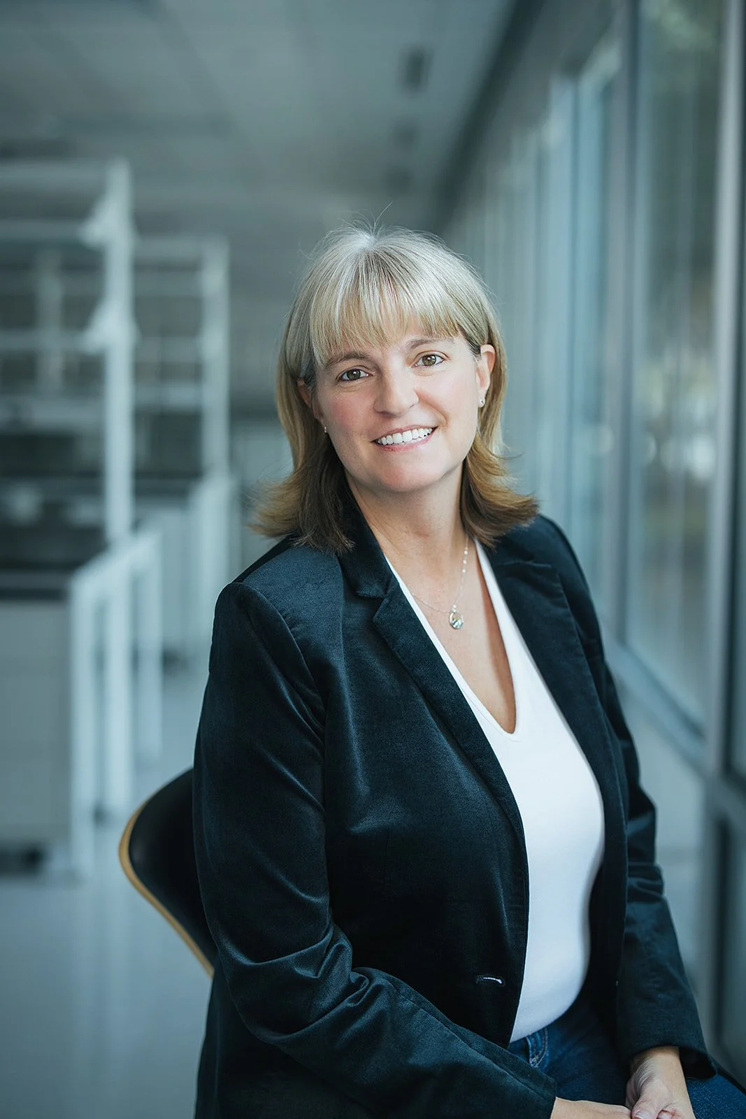 WomanSmilingWearingBlackBlazer