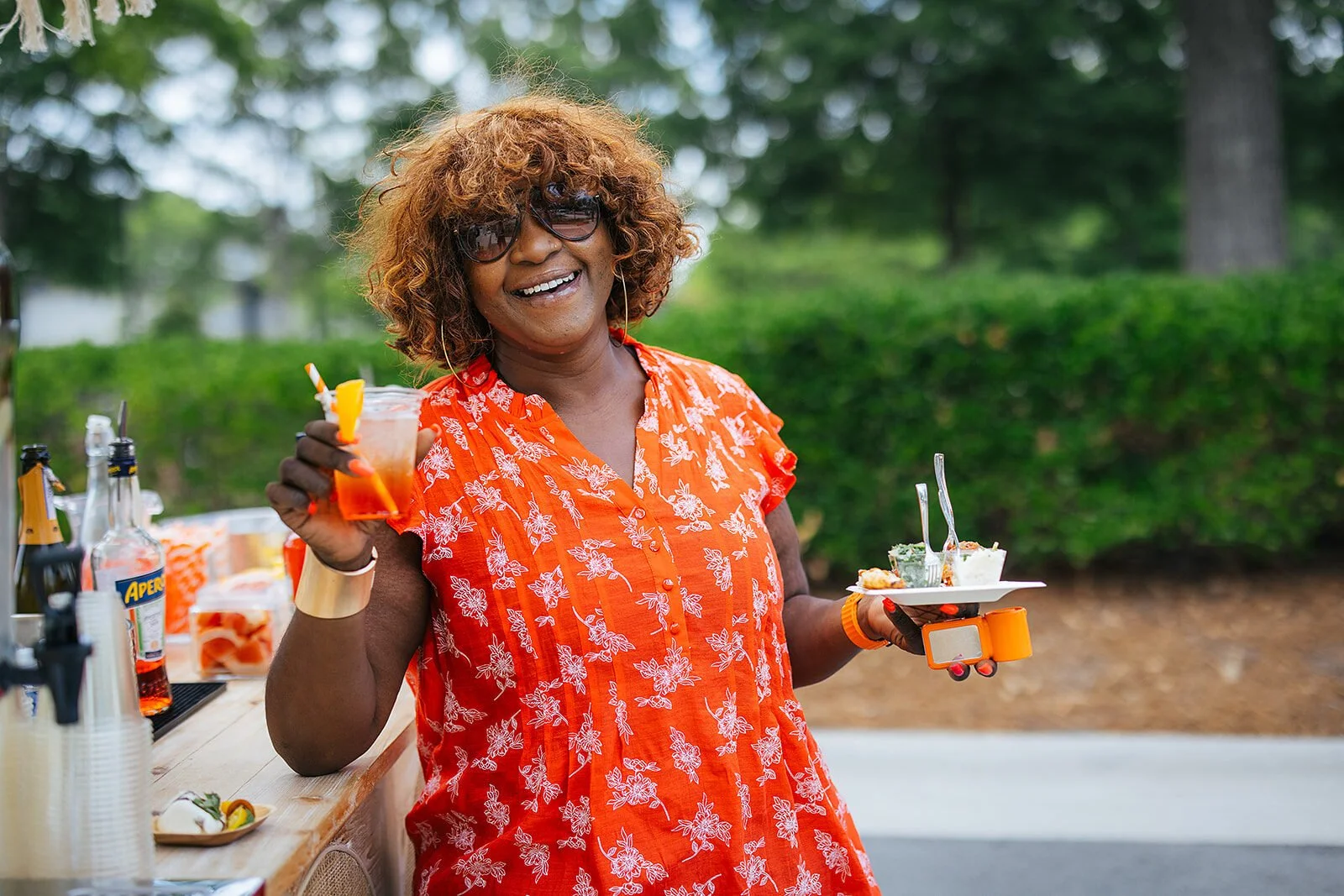 Woman Holding Drinks At Raleigh Event in Summer Event Photography
