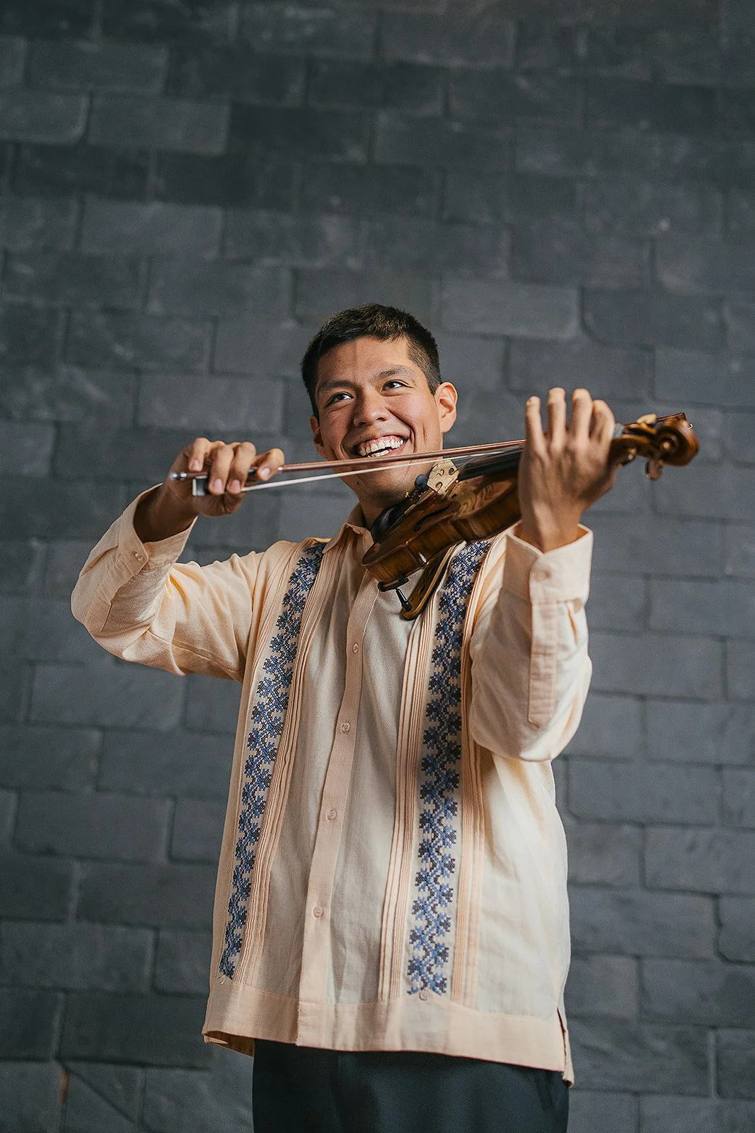 Man Smiling Playing Violin Durham Branding Photography Session with Chamber Orchestra of Triangle