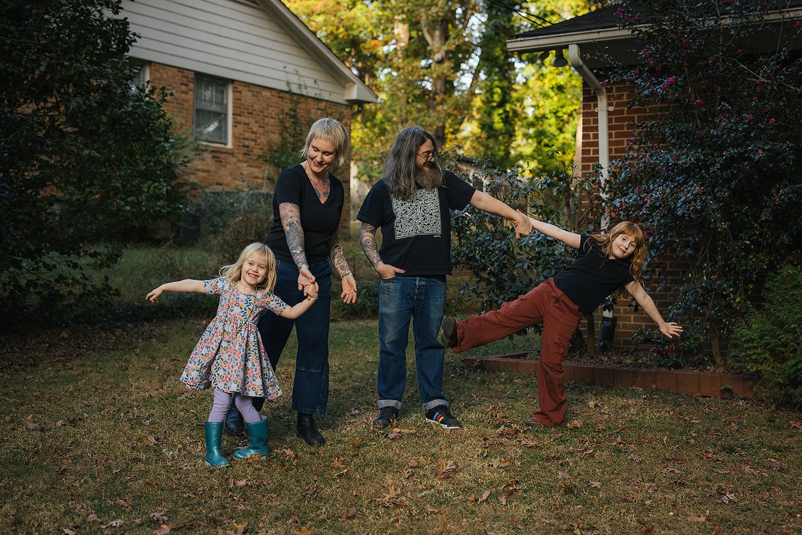 Family Playing Together Outside During Family Photo Session