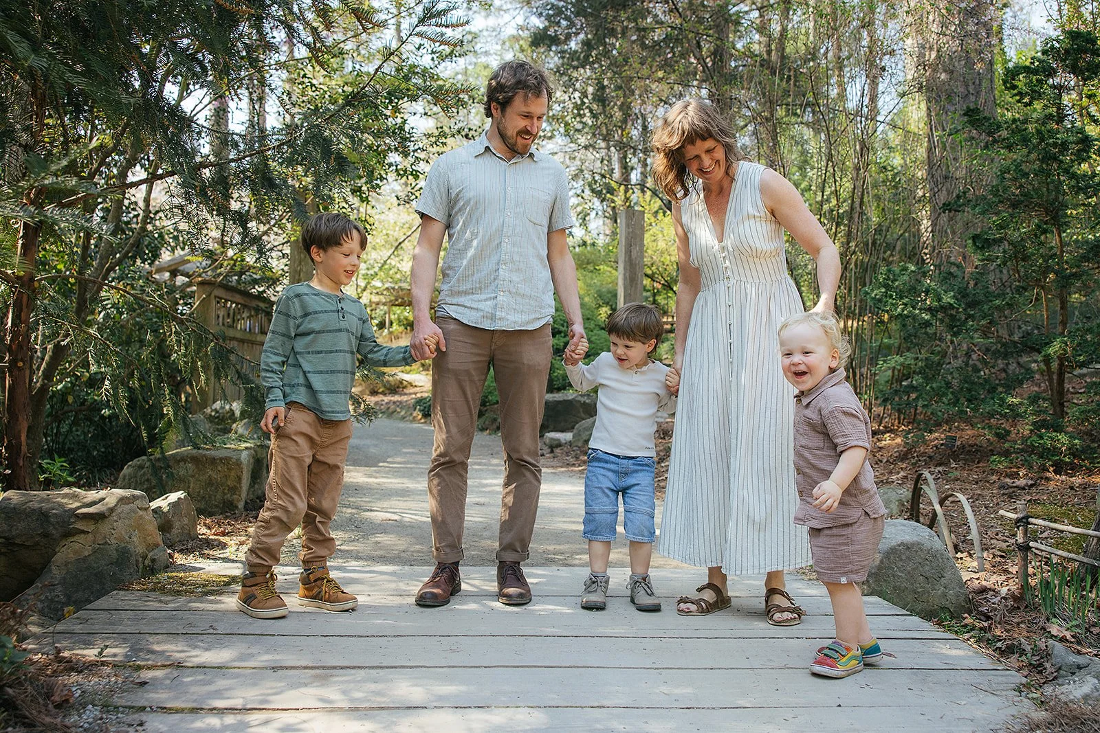 Family of Five Walking Through Paths At Duke Gardens