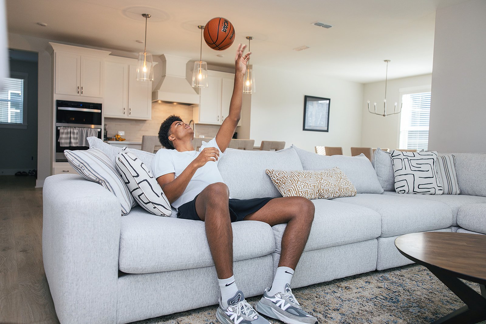 Duke basketball player in home done by AFR Furniture Rental in a Durham home
