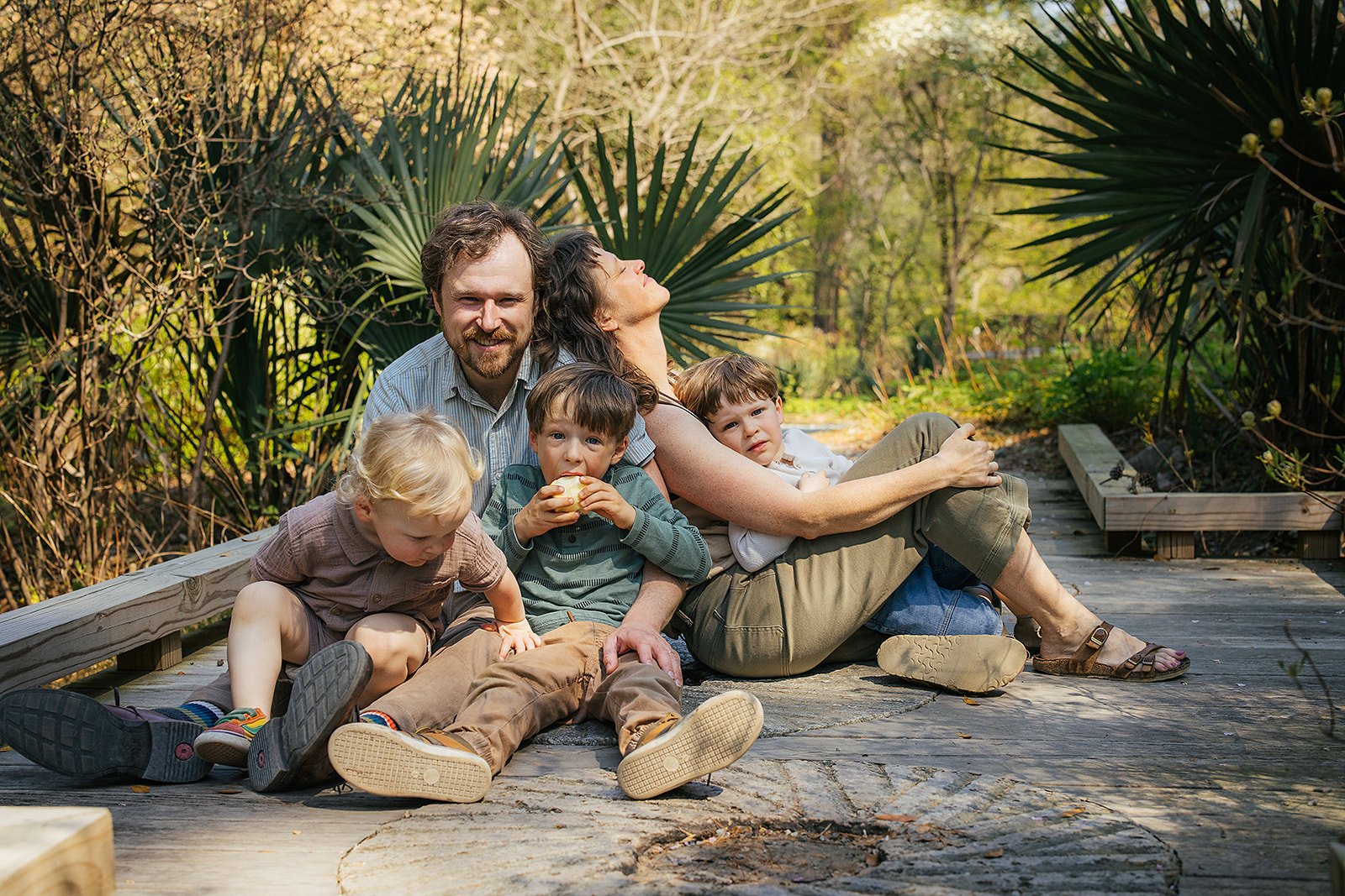 Family of Five Sitting in Duke Gardens Enjoying Sunshine