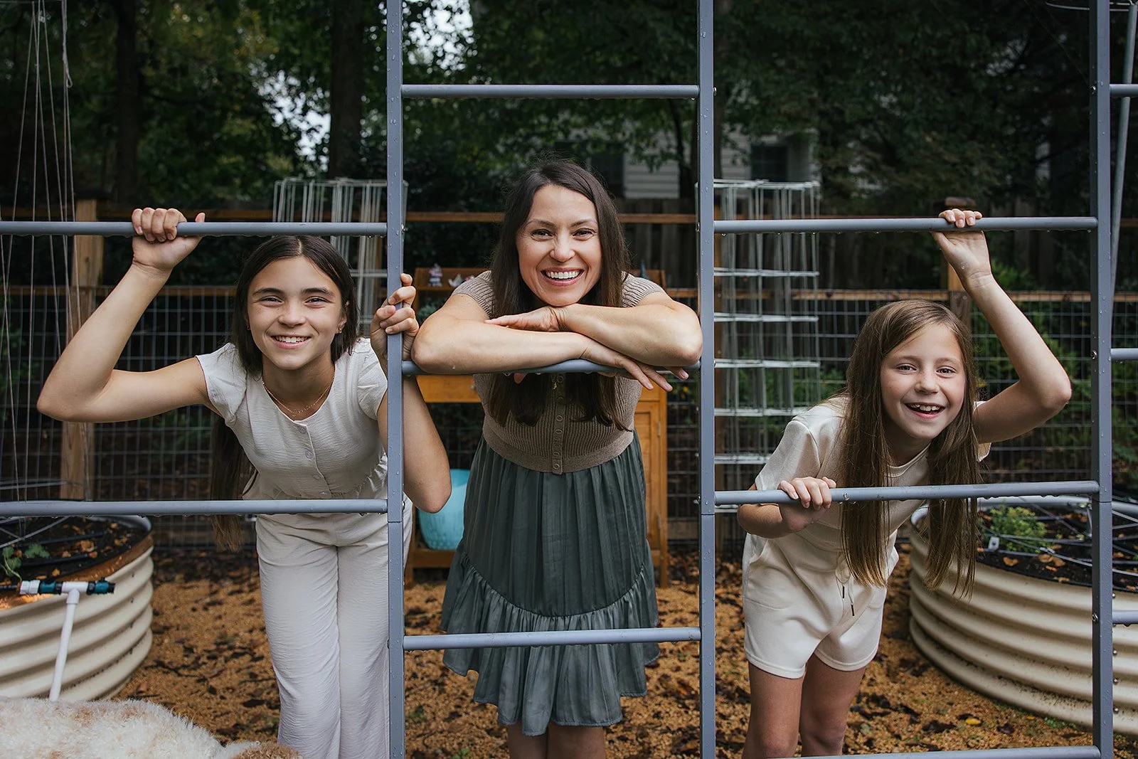 Mom and daughters hanging out in backyard garden Chapel Hill NC