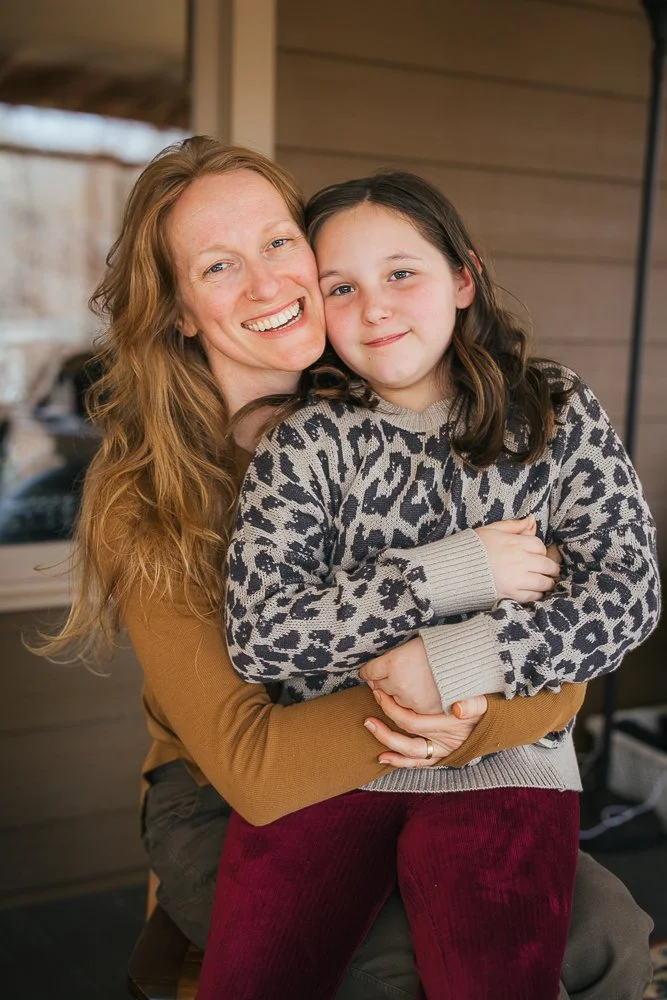 Woman Hugging Young Girl in Durham NC