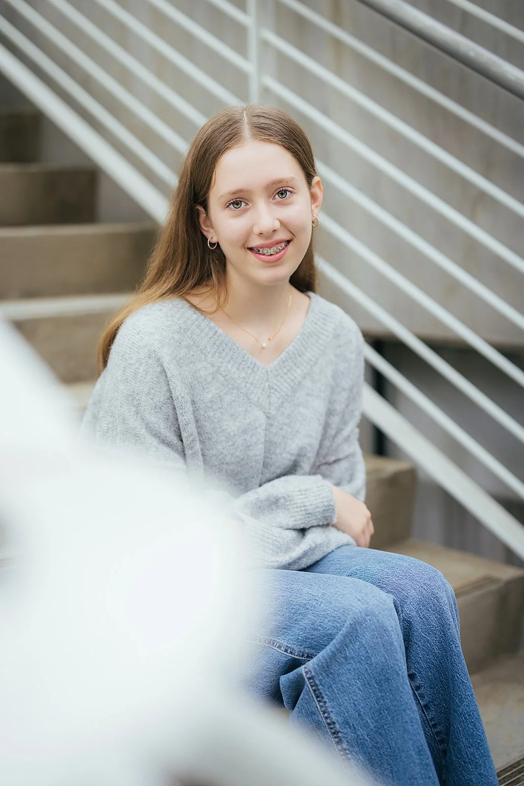 Young Girl Smiling SItting on Steps in WRAL Azalea Garden