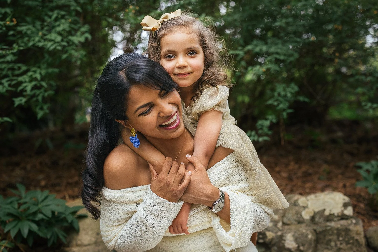 Mother carries daughter during a family photoshoot at Duke Gardens in Durham, NC