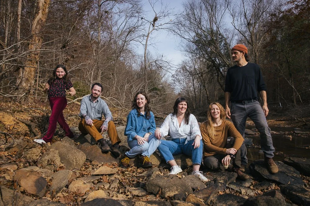 Friends Sitting on Rocks by River in Durham NC