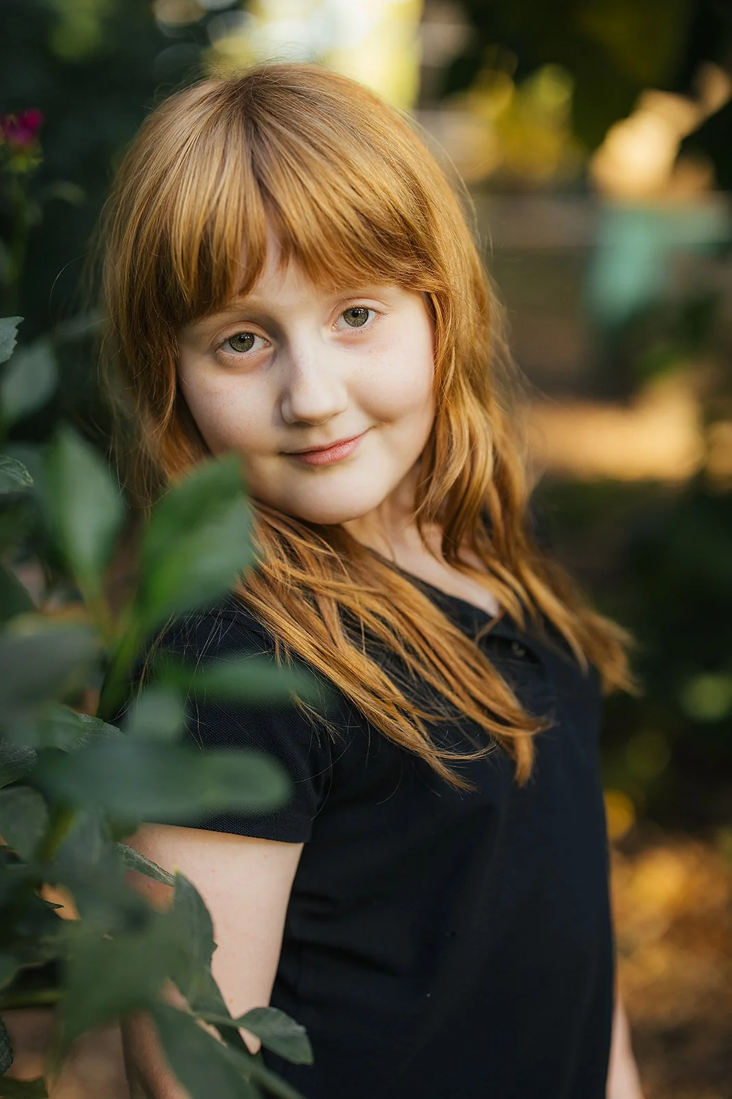 Young Girl in Black Shirt Smiling for Portrait