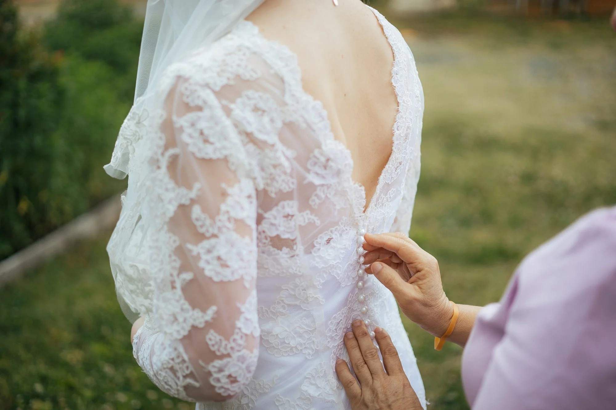 Bride's mother helping fasten the wedding dress — Durham wedding photographer