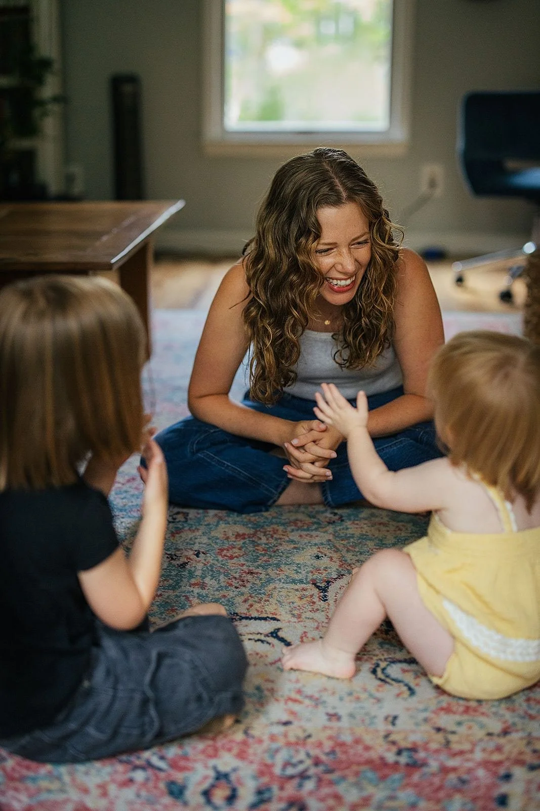 Mom Smiling and Laughing with Kids During At-Home Photography Session
