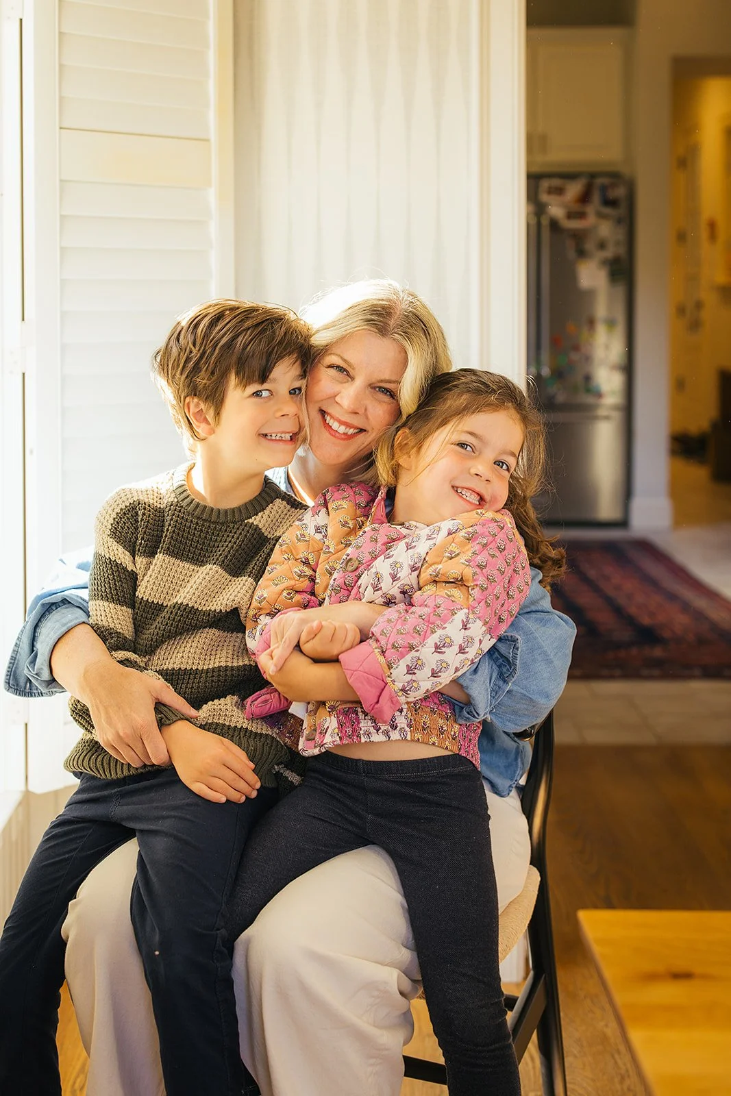 Mom Holding Both Kids Smiling