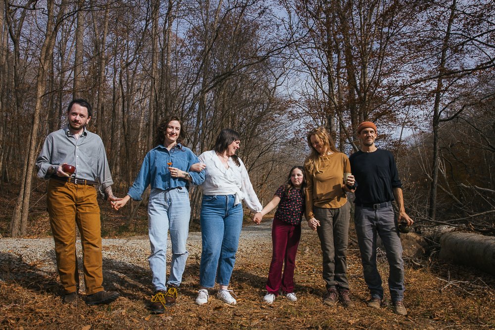 Family and Friends Walking Outside During Portrait Session