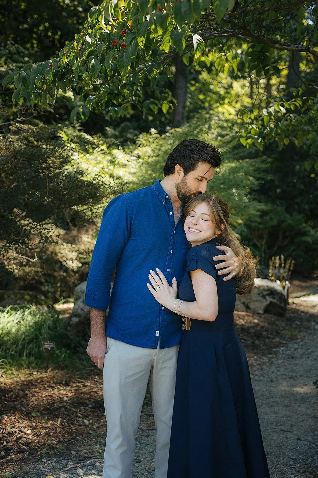 Couple hugging post engagement Sarah P Duke Gardens Durham NC