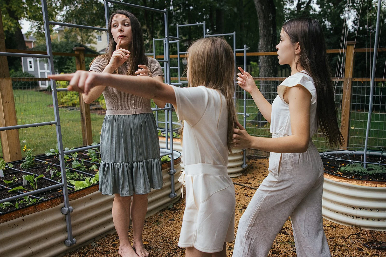 Mom and daughters in backyard garden Chapel Hill NC