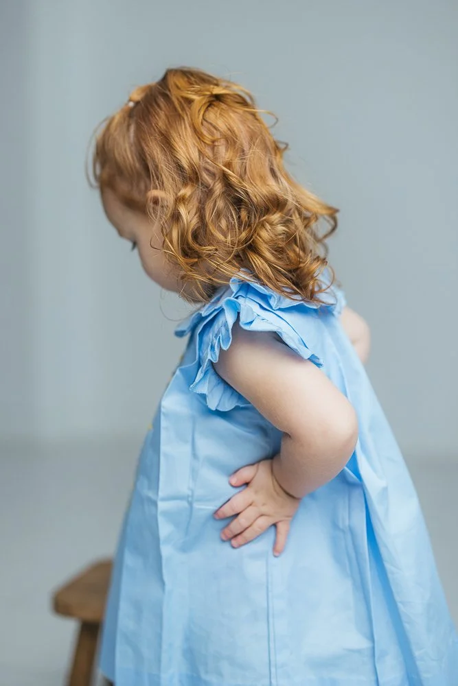 Studio child photography captures a toddler's red curls in Durham NC