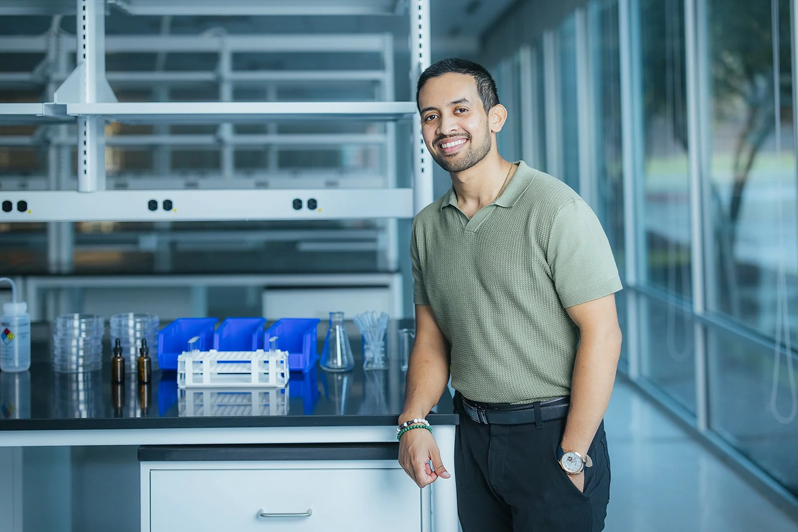 ManInGreenShirtSmilingInLabInRTPNC