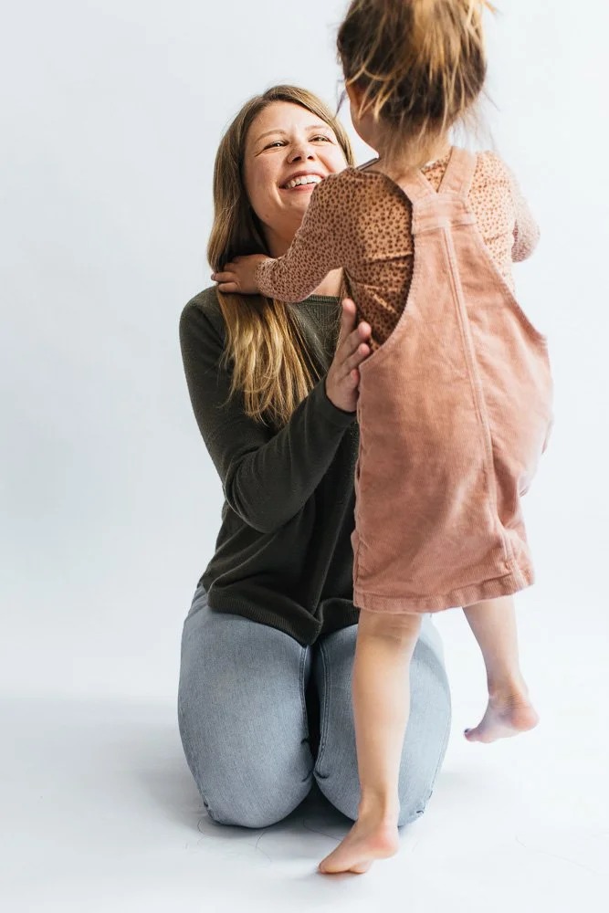 MomEmbracingYoungDaughter