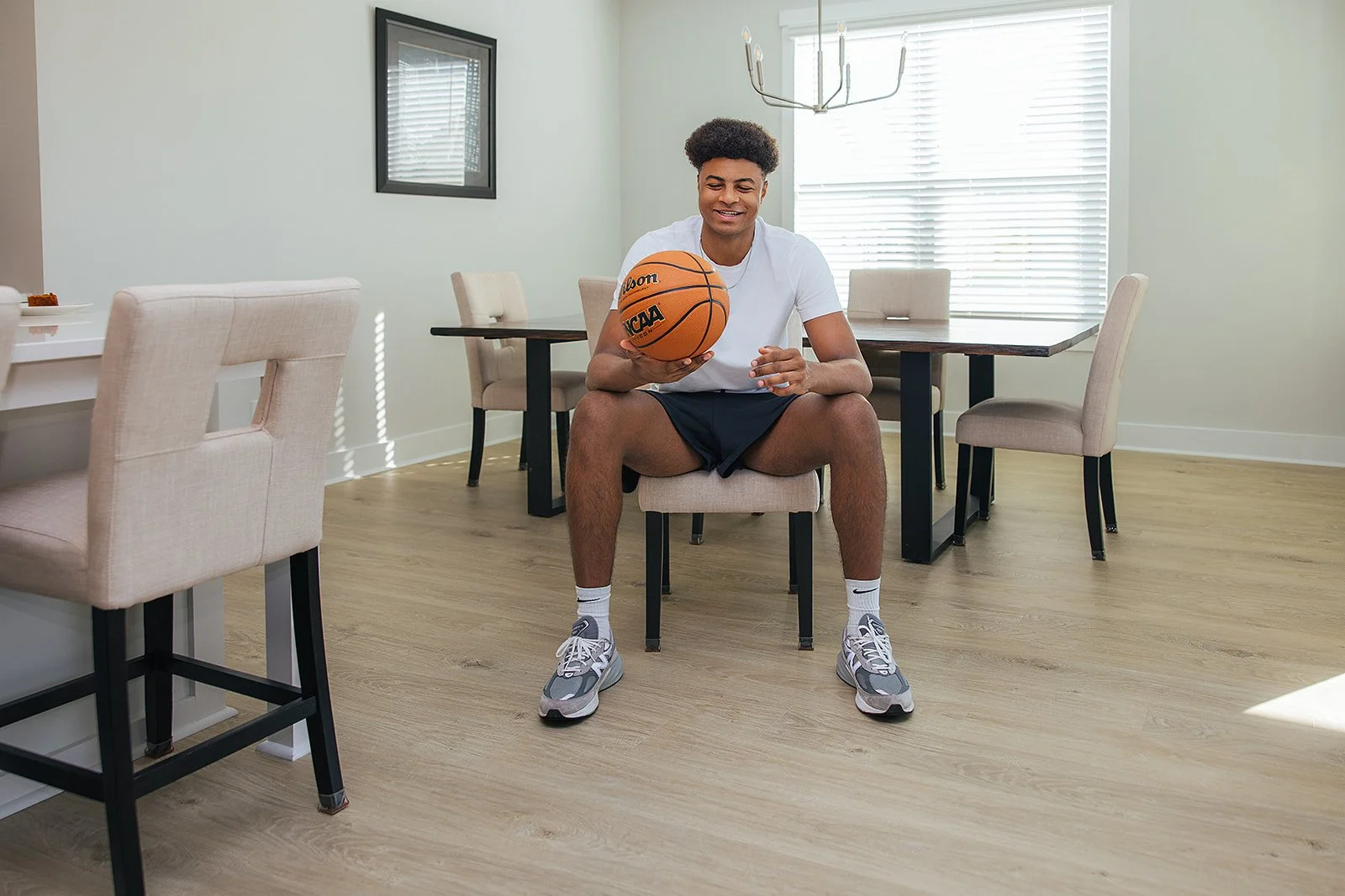 Duke basketball player in home done by AFR Furniture Rental in a Durham home