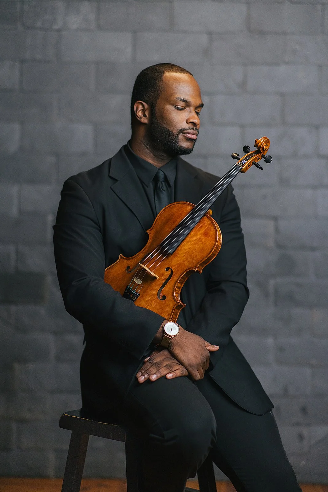 Man Sitting Holding Violin During Durham NC Branding Session