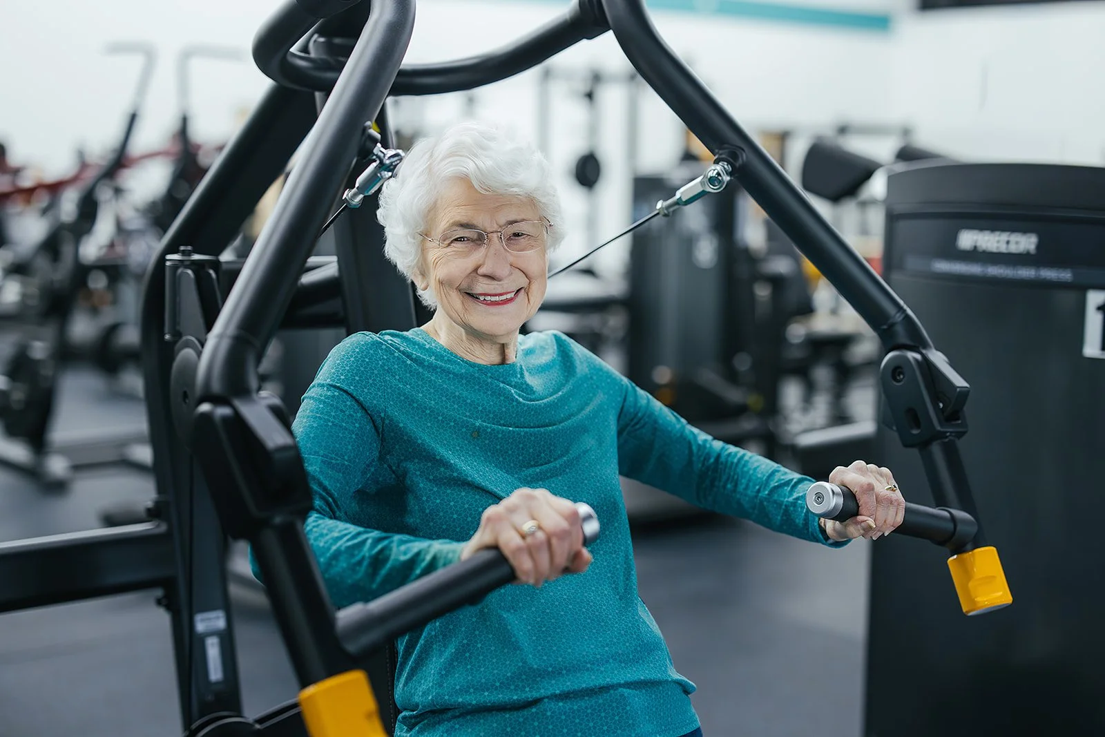 older woman poses for local wellness business photography in Durham, NC