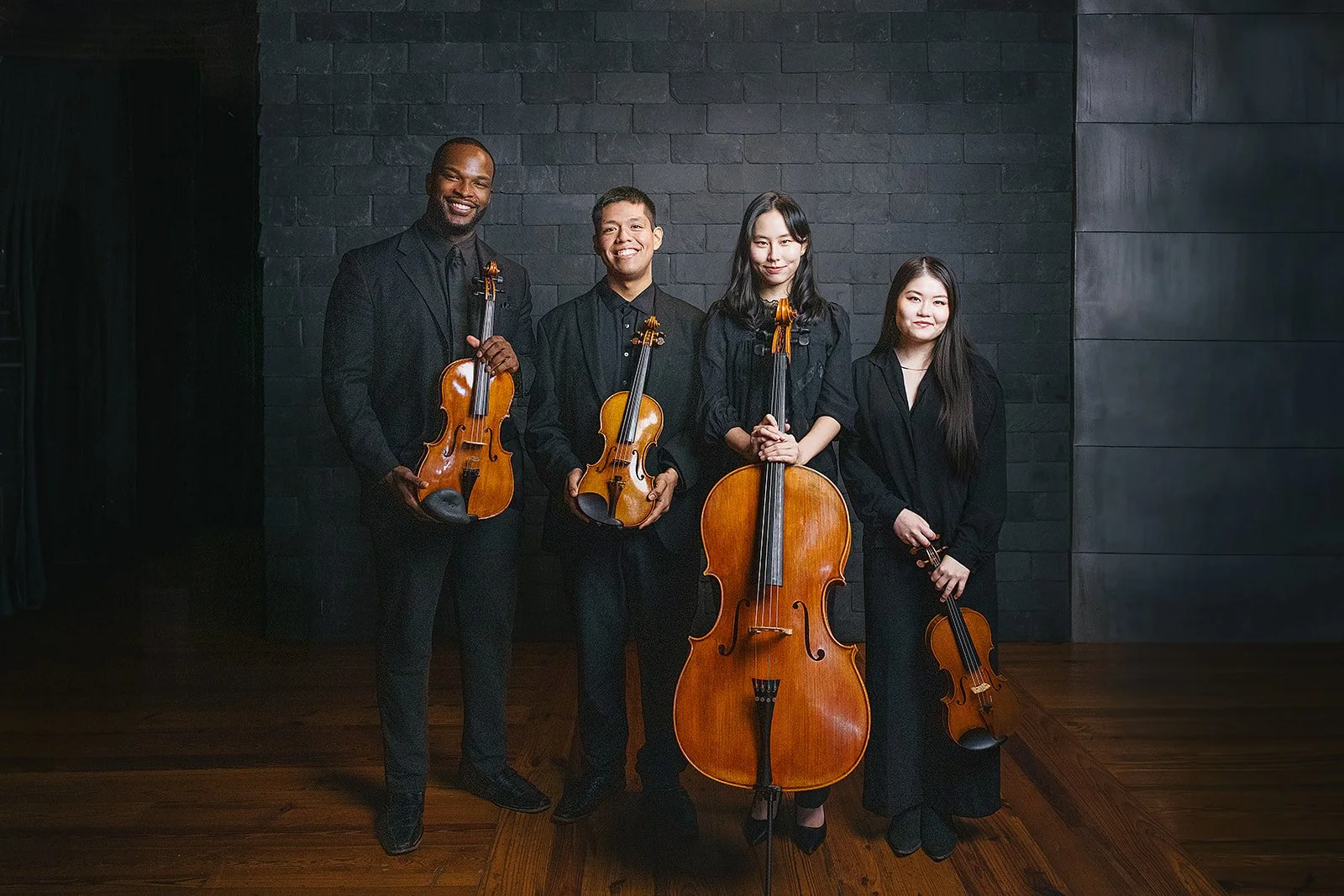 Four Members of Chamber Orchestra of the Triangle with their Instruments