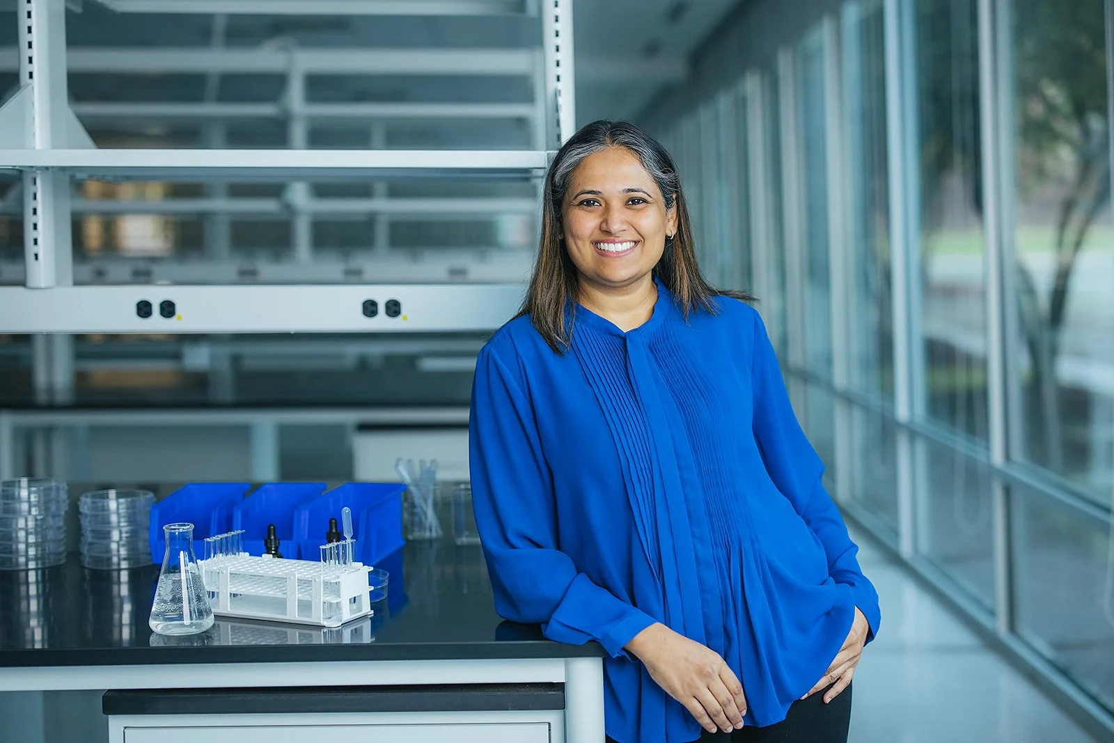 WomanInBlueShirtSmilingInLab