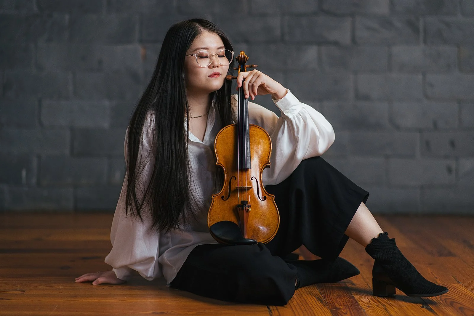 Woman Posing with Violin During Branding Session with Chamber Orchestra of the Triangle