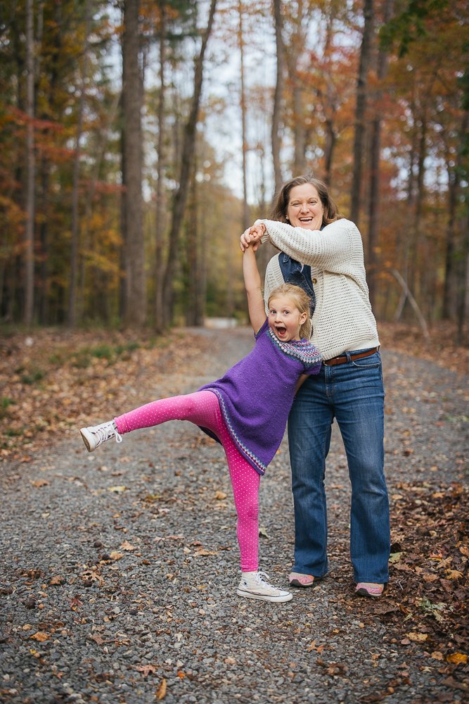mom and daughter playing in woods in Durham NC backyard