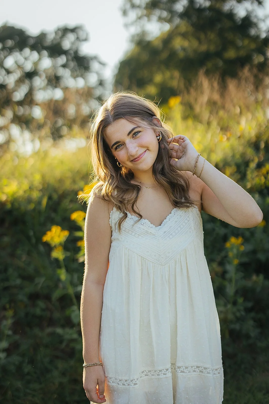 Senior Girl Smiling in Front Yellow Flowers Blackwood Farm Park