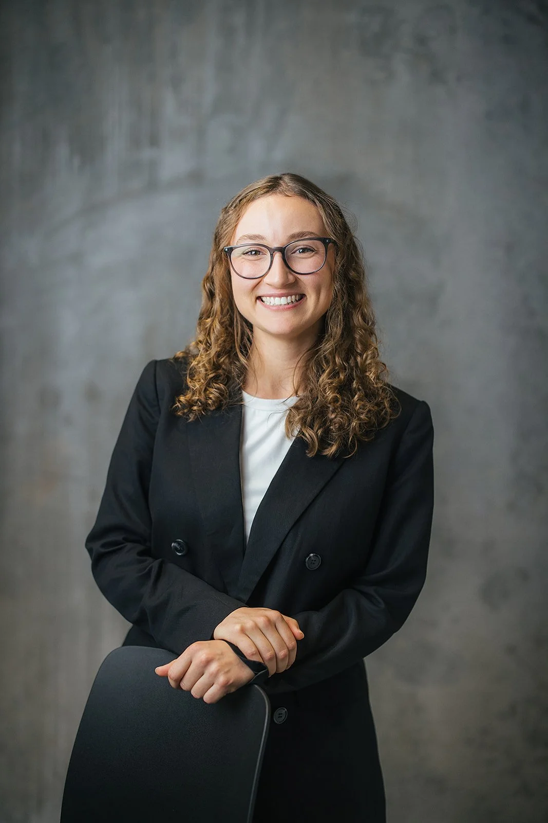 Woman in Black Blazer During Corporate Headshot Session