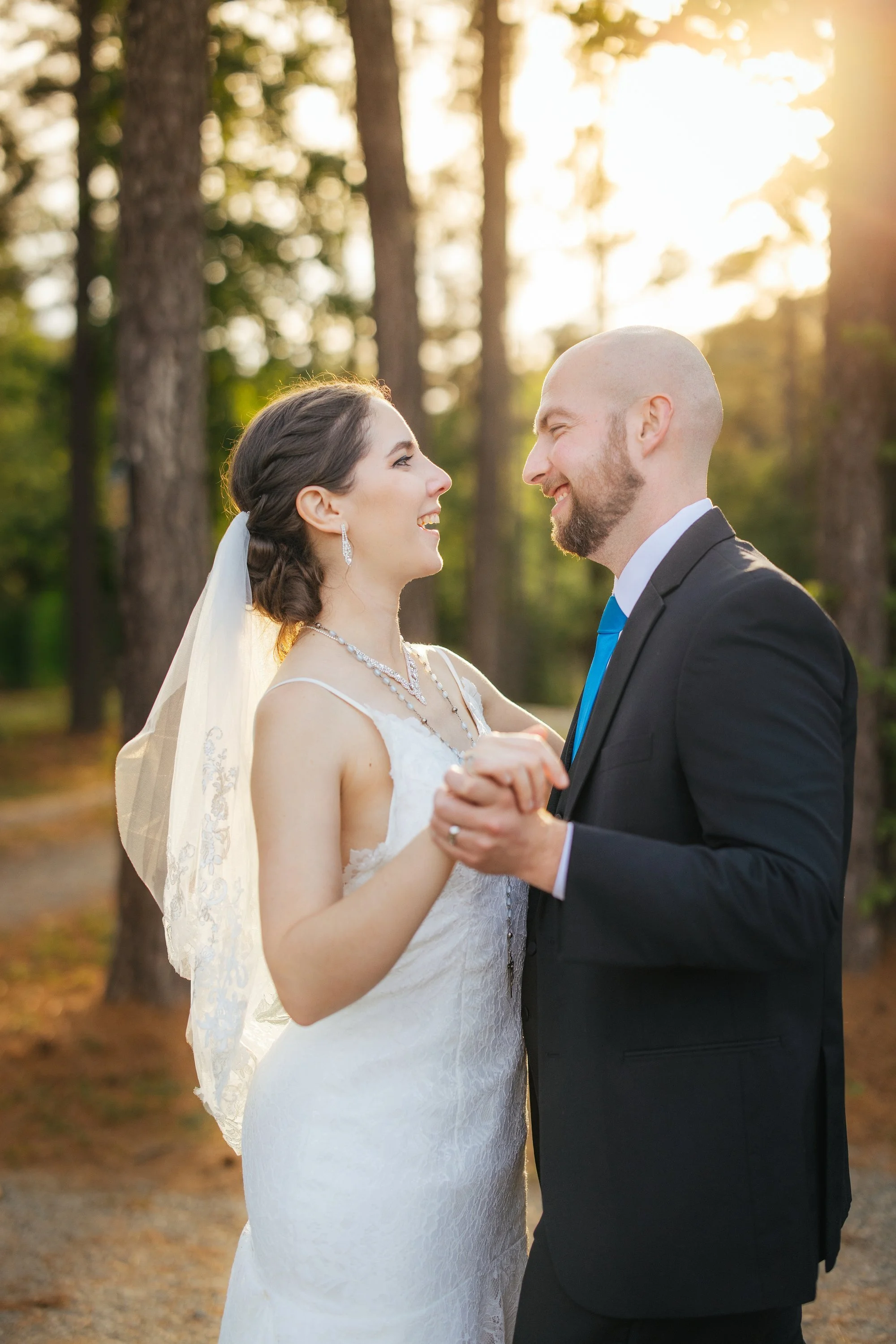 Newlyweds embracing at The Honeysuckle Tea House — Raleigh wedding photographer