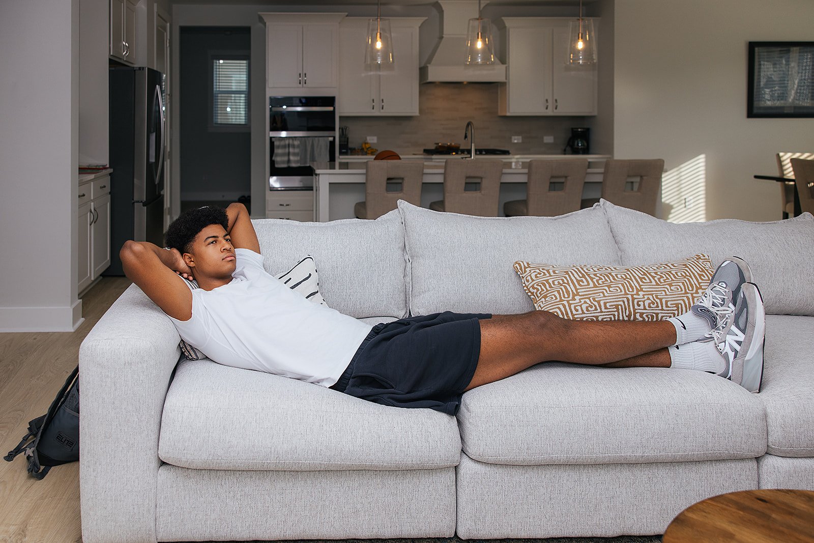 Duke basketball player in home done by AFR Furniture Rental in a Durham home