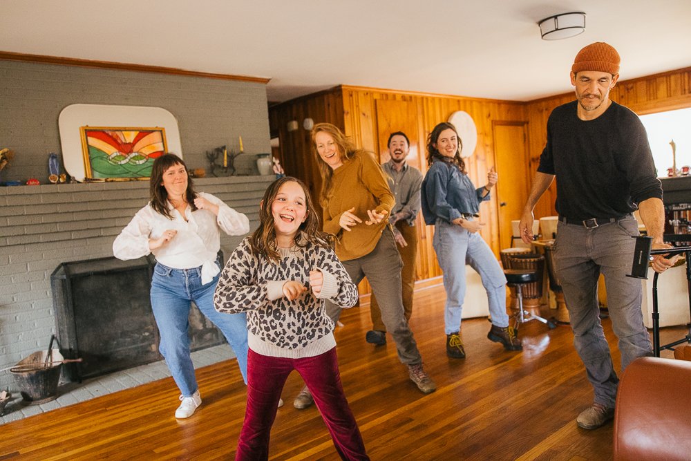 Friends Having Dance Party in Living Room During In-Home Family Photography Session