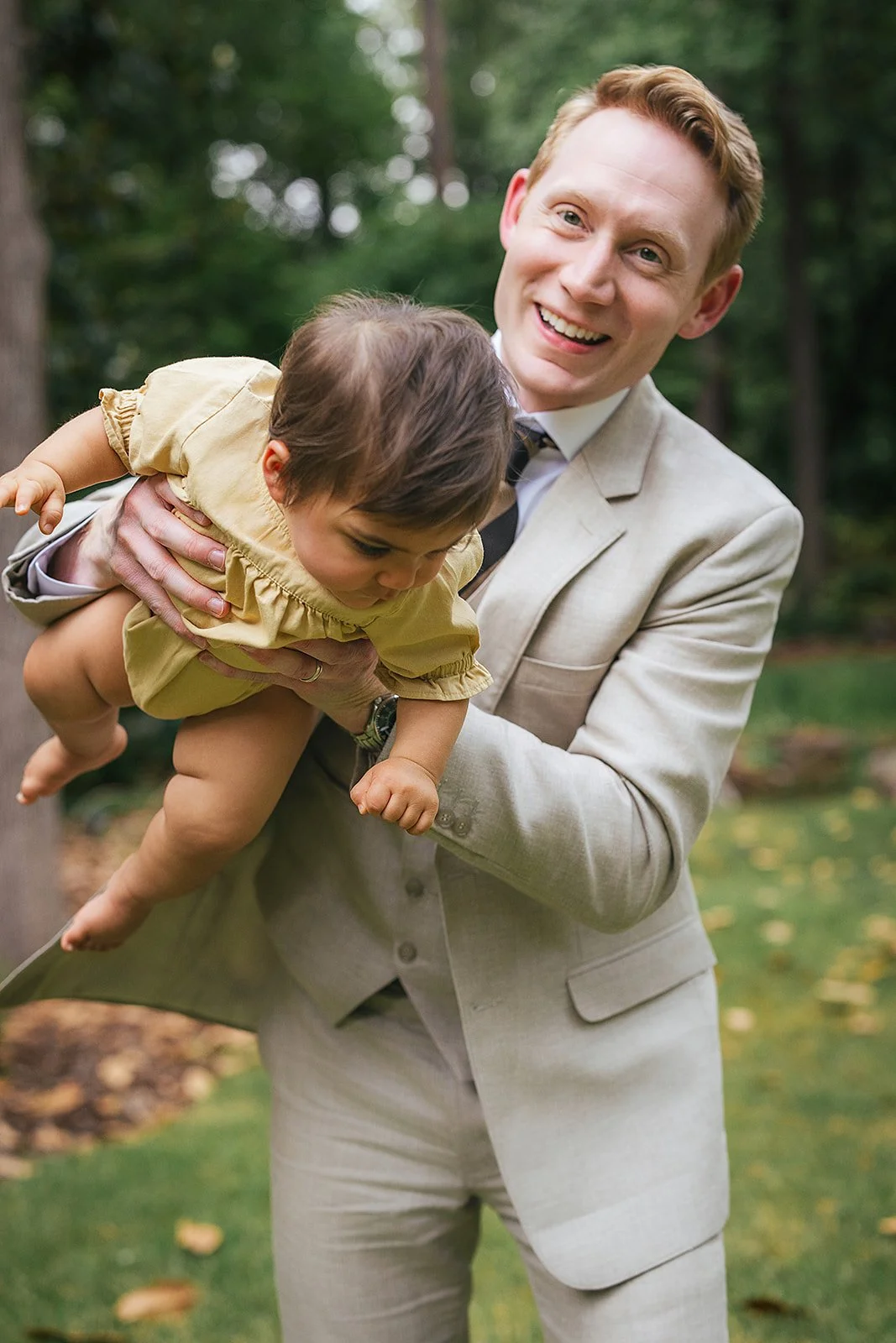 Dad Holding Young Baby and Smiling Durham family Photography Session
