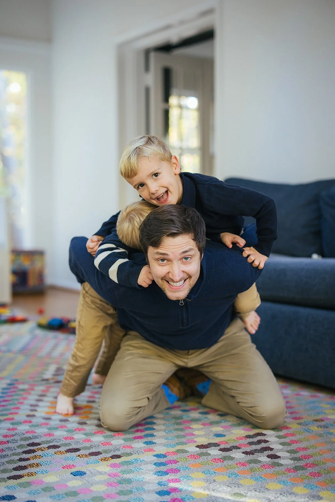 DadAndYoungSonsWrestlingFamilyPhotoSession