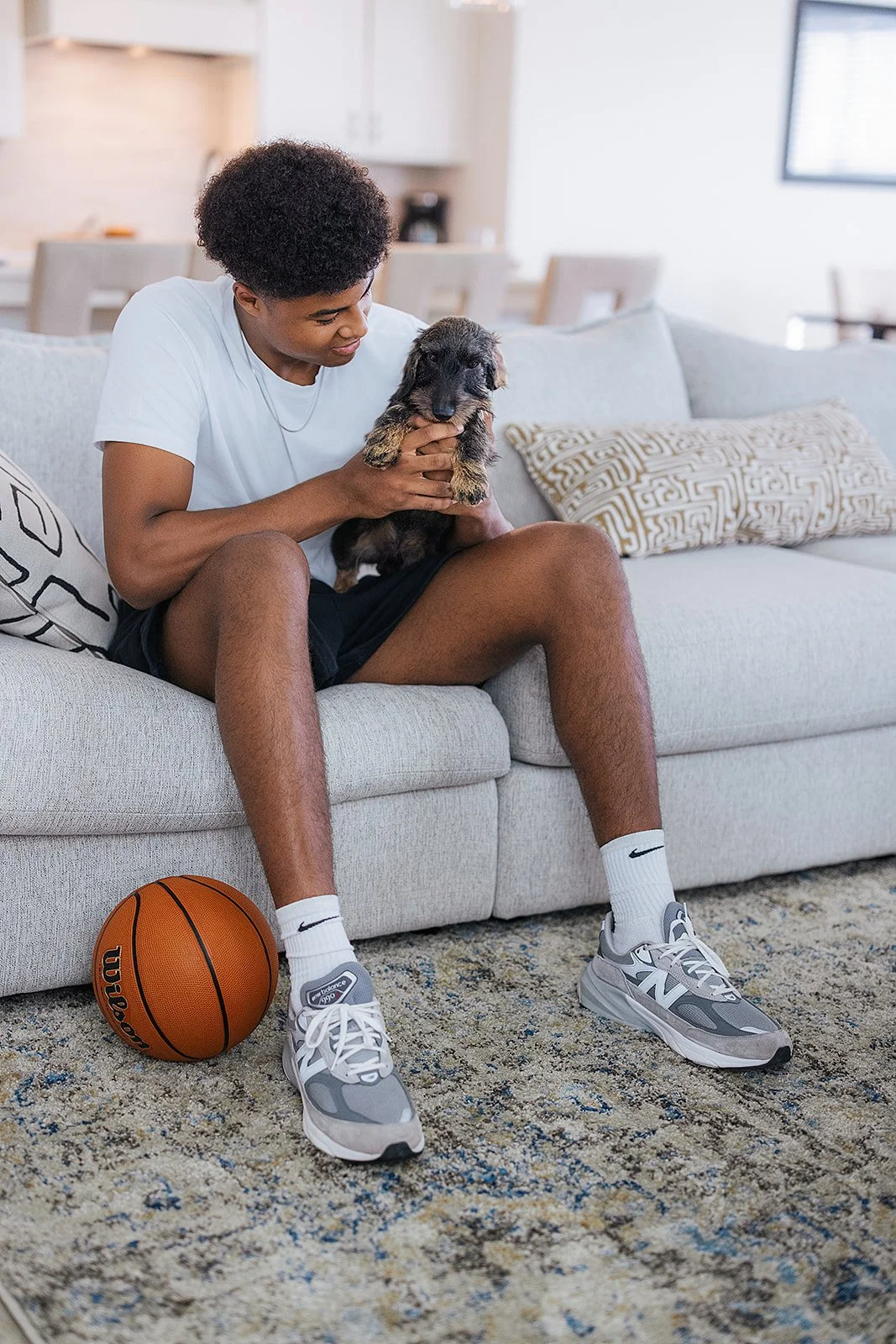 Duke basketball player in home done by AFR Furniture Rental in a Durham home