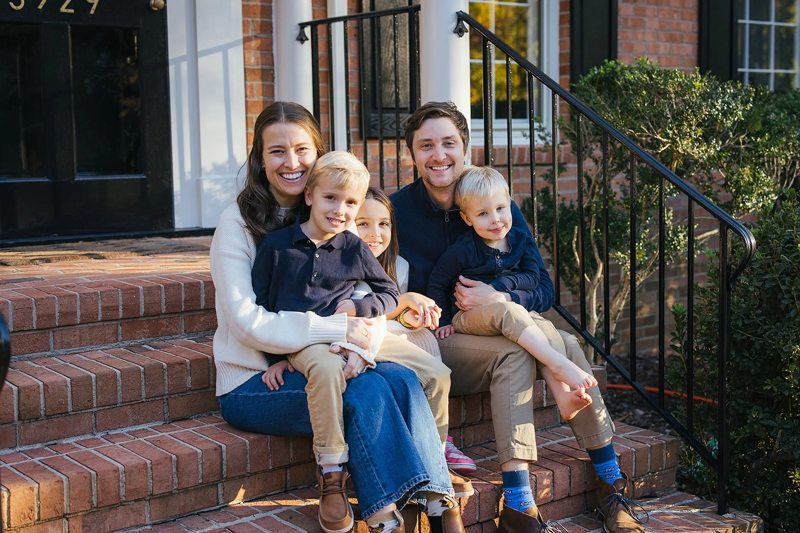 PortraitFamilyFiveOnFrontPorchStepsChapelHillNC