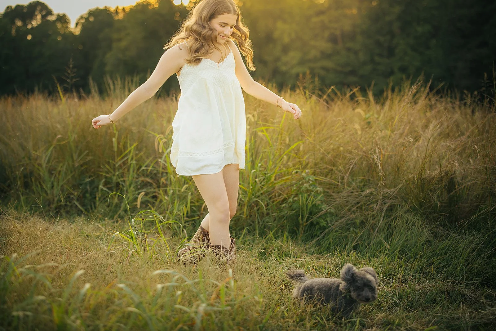 Senior Girl Running Through Grass with Dog