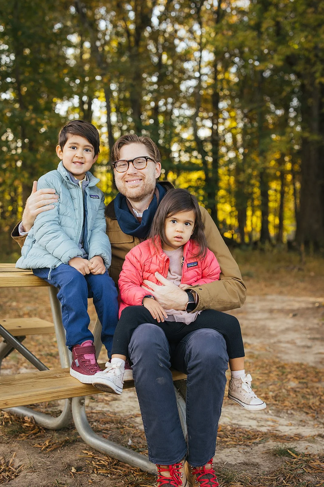 Father poses with two children in Blackwood Farm Park for Hillsborough family photoshoot