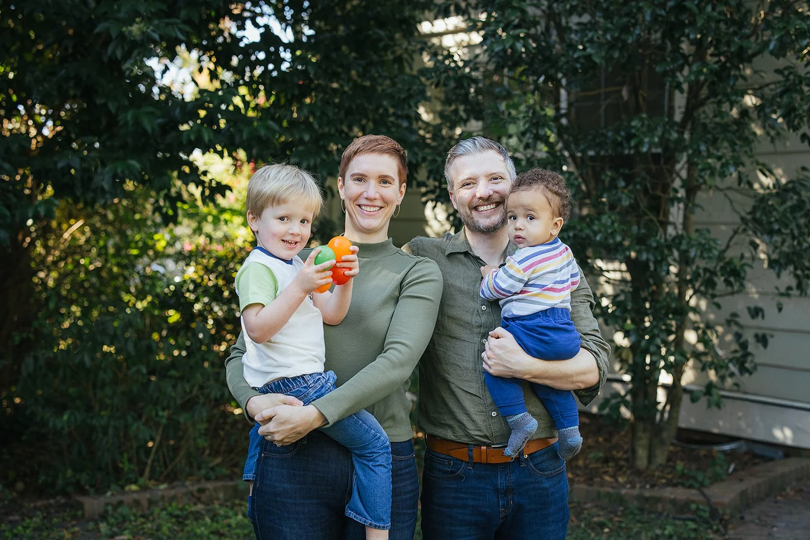 Family with Two Young Kids Smiling in Backyard in Durham, NC