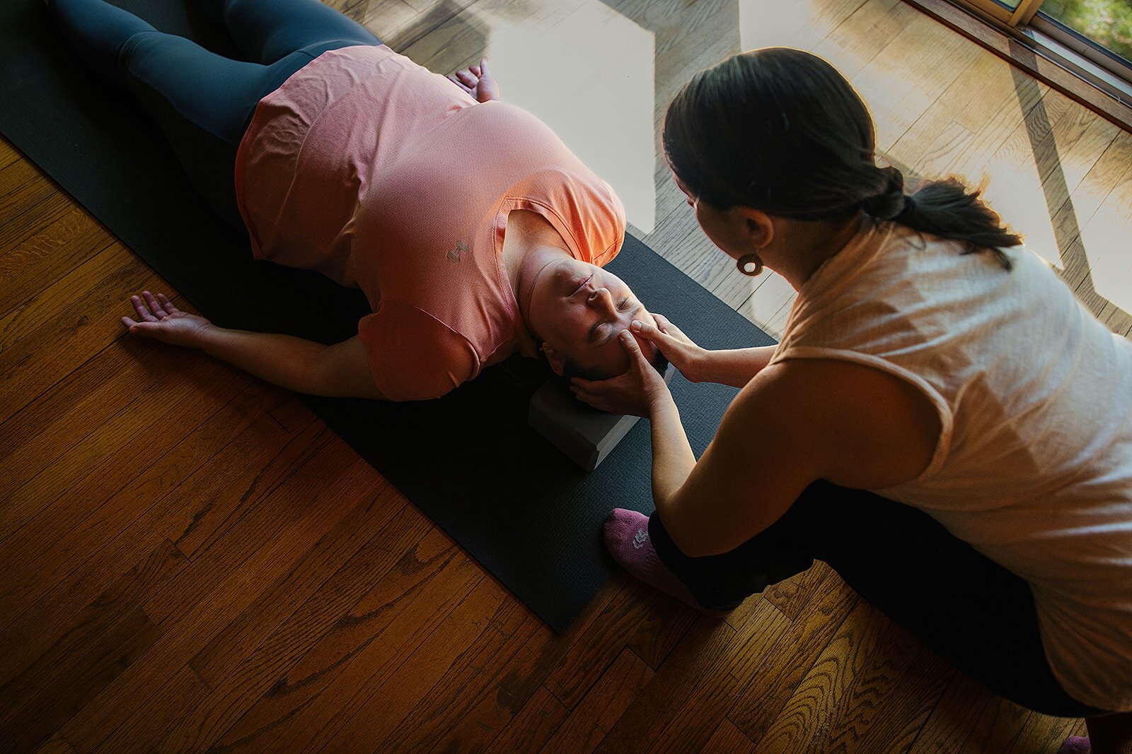 Brand photographer in Durham captures a yoga flow indoors